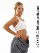 Young woman showing off weight loss