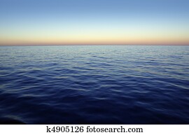 Beautiful sunset sunrise over blue sea ocean red  sky