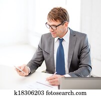 businessman working with laptop and smartphone