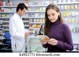 Consumer with medicine at pharmacy Consumer with medicine at pharmacy