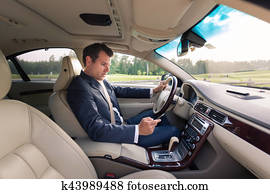 Man using cell phone while driving