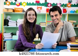 Teacher and parent in classroom Teacher and parent in classroom