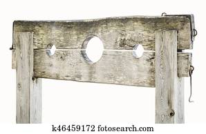 Wooden medieval pillory on white