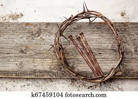 Jesus Crown Thorns and nails on Old and Grunge Wood Background. Vintage Retro Style.