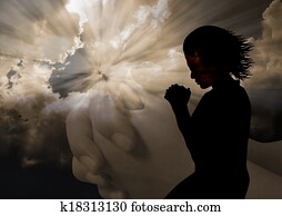 Woman praying silhouette