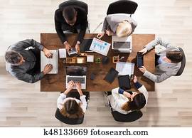 Business Colleague Working At Workplace