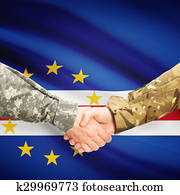 Men in uniform shaking hands with flag on background - Cape Verde