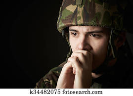 Soldier In Uniform Suffering From Stress Soldier In Uniform Suffering From Stress