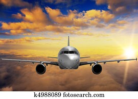 Airplane on sunset sky Airplane on sunset sky