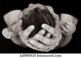 Baby in father's hands Baby in father's hands