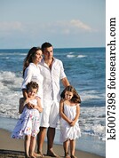 happy young family have fun on beach