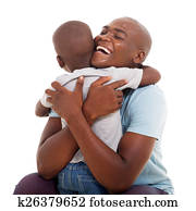 african american man hugging his son
