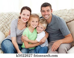 Happy family sitting on the sofa