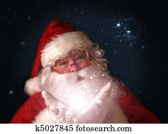 Santa holding magical christmas lights in hands Santa holding magical christmas lights in hands