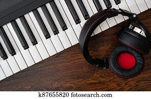 Piano and headphones. Recording studio concept.
