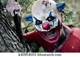 scary evil clown with a knife scary evil clown with a knife