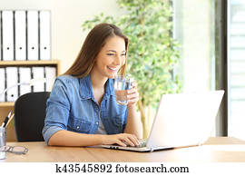 Entrepreneur working and drinking water Entrepreneur working and drinking water