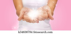 magic twinkles or fairy dust on female hands magic twinkles or fairy dust on female hands
