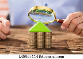 Person Looking Through Magnifying Glass