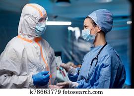 Doctors holding samples in hospital, coronavirus concept. Doctors holding samples in hospital, coronavirus concept.