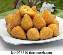 Coxinha de Galinha - Brazilian deep fried chicken snack, popular at local parties. Served with chili sauce.