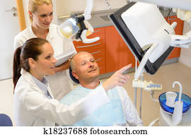 Man patient at dental consultation dentist surgery Man patient at dental consultation dentist surgery