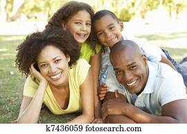 Portrait of Happy Family Piled Up In Park