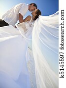 Bride & Groom Married Couple Kissing at Beach Wedding Bride & Groom Married Couple Kissing at Beach Wedding