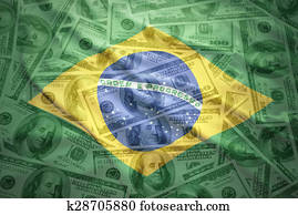 colorful waving brazilian flag on a american dollar money background