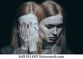 Girl covering her face