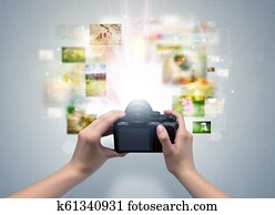 Hand captures life events with digital camera