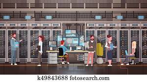 People Working In Data Center Room Hosting Server Computer Monitoring Information Database People Working In Data Center Room Hosting Server Computer Monitoring Information Database