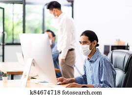 Asain employee face mask in new normal office
