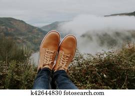 boots in the foreground on the panoramic view of the Valley, concept of adventure and travel