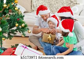 Family opening Christmas gift