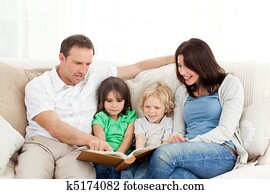 Happy family looking at a photo