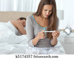 Pretty woman looking a pregnancy test Pretty woman looking a pregnancy test