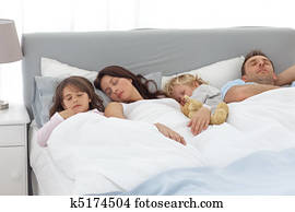 Relaxed family doing a nap together