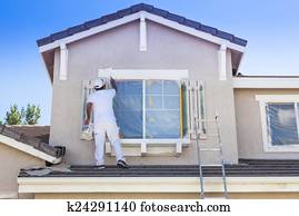 House Painter Painting the Trim And Shutters of Home House Painter Painting the Trim And Shutters of Home