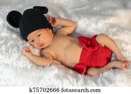 newborn baby in mouse costume on fur bed newborn baby in mouse costume on fur bed