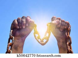 Two male hands are raised upwards