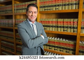 Lawyer standing in the law library Lawyer standing in the law library