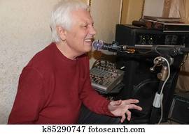 portrait of a handsome young man listening to music indoor
