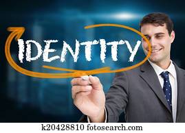 Businessman writing the word identity