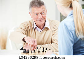 homem sênior, xadrez jogando, com, adolescente, neta