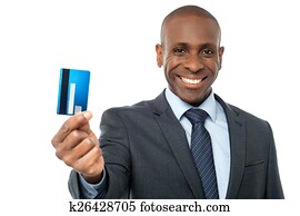 Cheerful businessman holding credit card