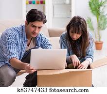 Young family moving in to new apartment after paying off mortgag Young family moving in to new apartment after paying off mortgag