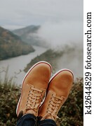 boots in the foreground on the panoramic view of the Valley, concept of adventure and travel