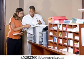 Multiracial office workers working on documents