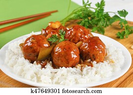 meatballs in sauce served with rice